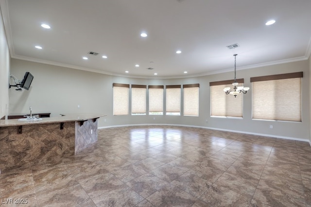 interior space featuring sink, crown molding, and an inviting chandelier