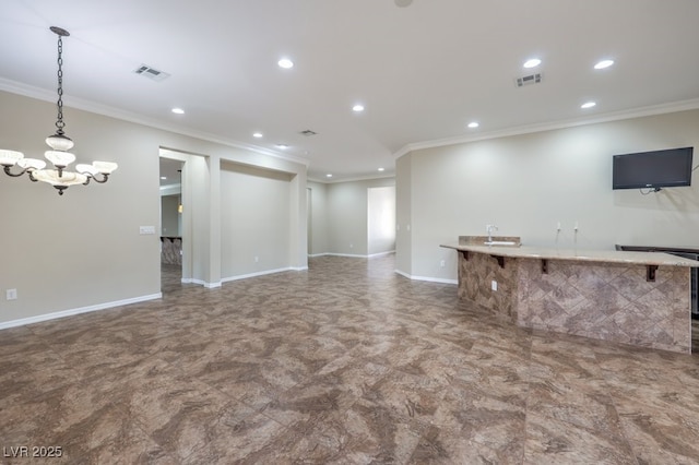 unfurnished living room with an inviting chandelier and ornamental molding