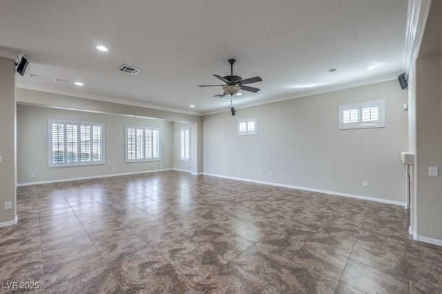 spare room with ceiling fan and ornamental molding