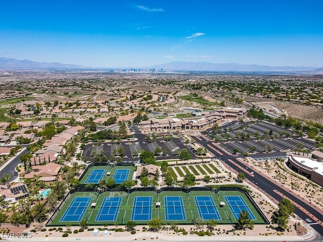 birds eye view of property with a mountain view