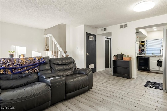 living room with a textured ceiling