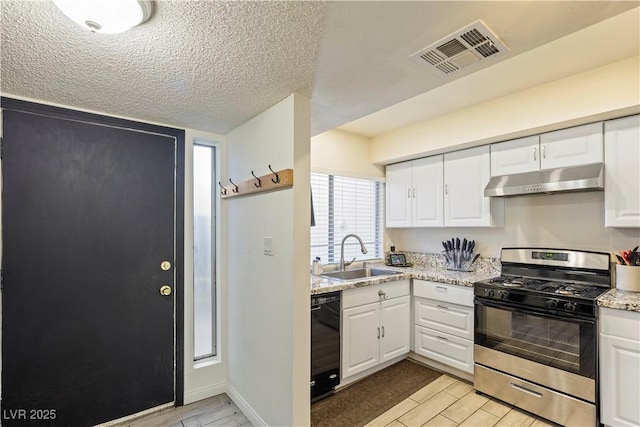 kitchen with black dishwasher, gas stove, white cabinets, and sink