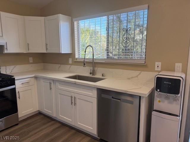 kitchen featuring sink, white cabinetry, and stainless steel appliances