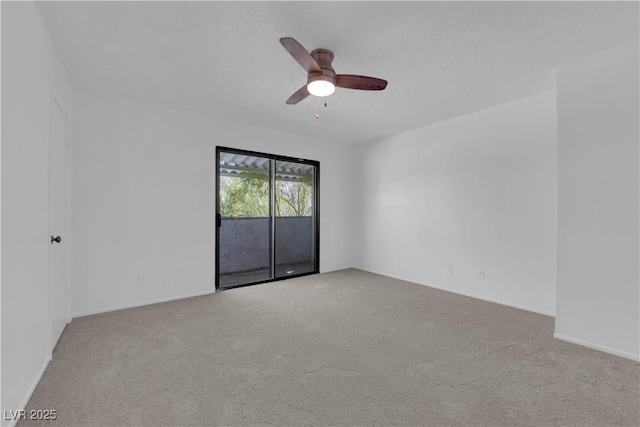 empty room with light carpet and ceiling fan