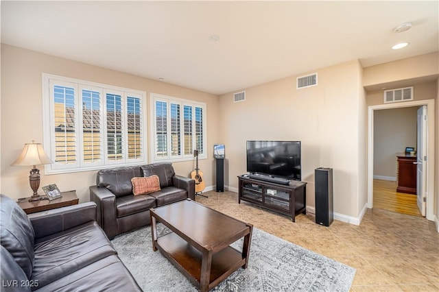 tiled living room with a healthy amount of sunlight