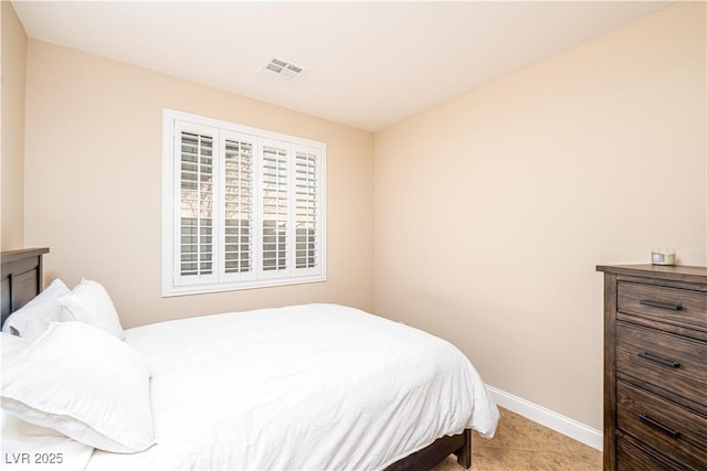 bedroom with light tile patterned flooring