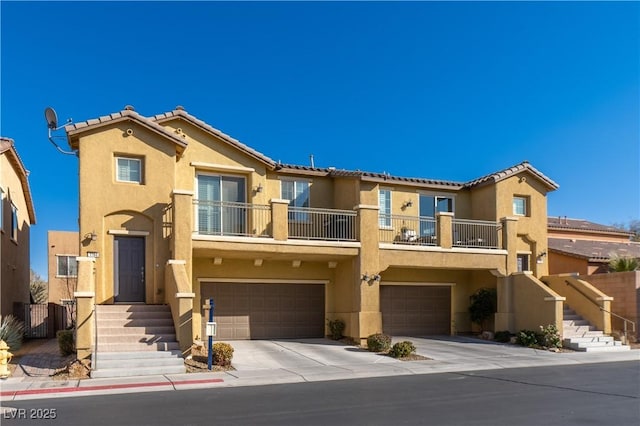 view of front of property with a balcony and a garage