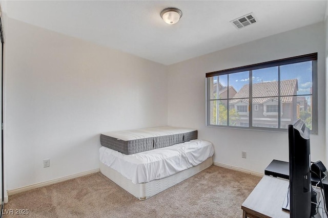 unfurnished bedroom featuring light carpet