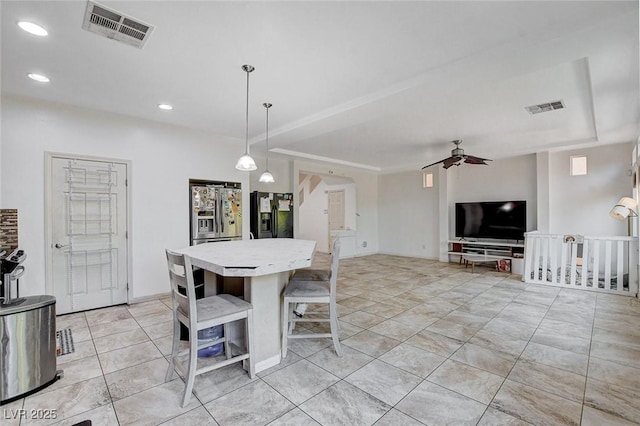 dining room featuring ceiling fan