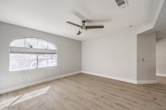 spare room featuring light hardwood / wood-style floors and ceiling fan