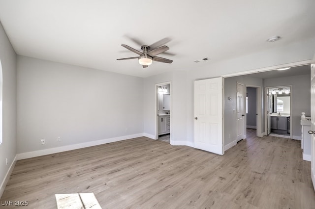 unfurnished bedroom featuring ceiling fan, light wood-type flooring, and ensuite bath