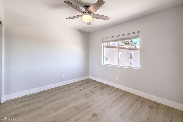 spare room with light hardwood / wood-style flooring and ceiling fan