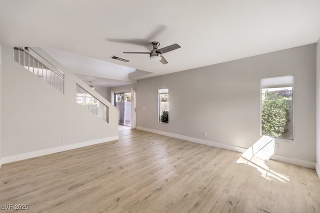 unfurnished living room featuring ceiling fan and light wood-type flooring