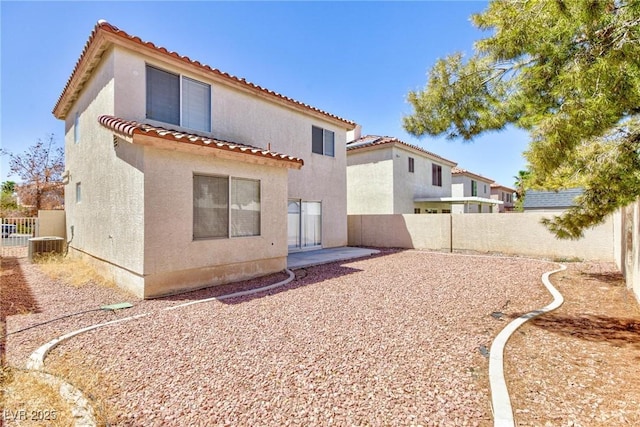 back of property featuring a patio area