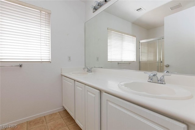 bathroom featuring tile patterned floors and vanity