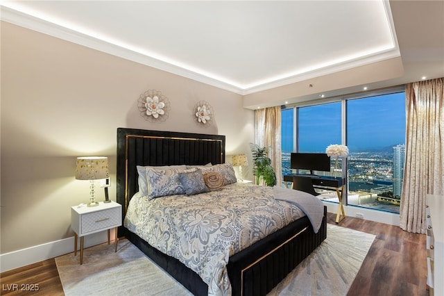 bedroom featuring hardwood / wood-style floors and ornamental molding