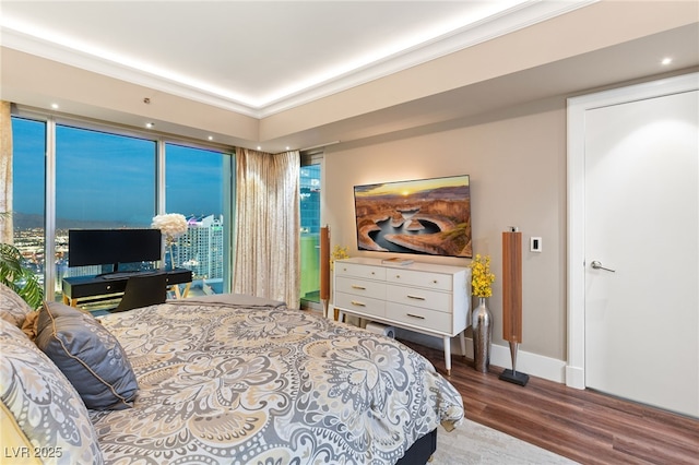 bedroom with wood-type flooring and ornamental molding