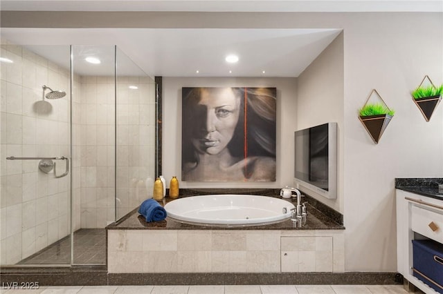 bathroom with tile patterned floors, plus walk in shower, and vanity