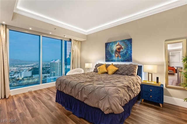 bedroom featuring hardwood / wood-style flooring and crown molding