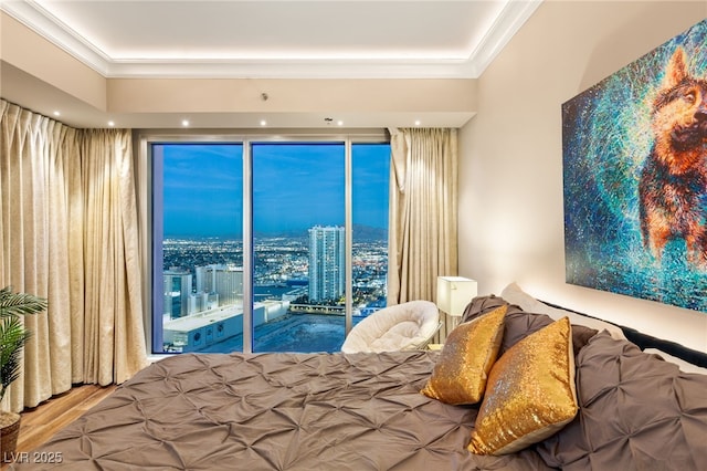 bedroom featuring hardwood / wood-style floors, access to outside, and crown molding