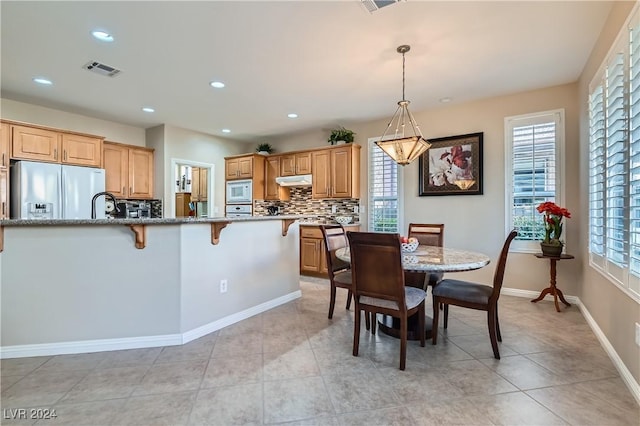 dining space with light tile patterned flooring