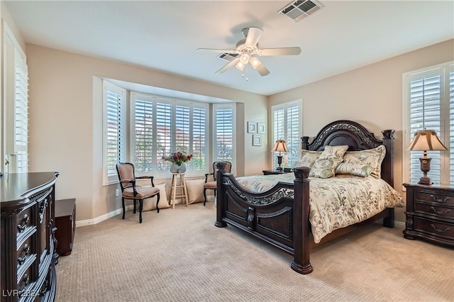 bedroom featuring ceiling fan and light carpet