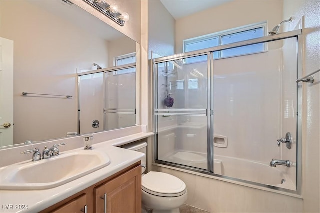 full bathroom with toilet, vanity, and enclosed tub / shower combo