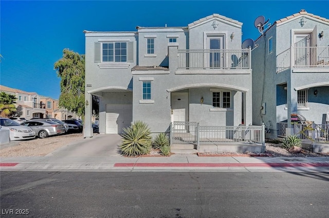 view of front of house with a garage and a balcony