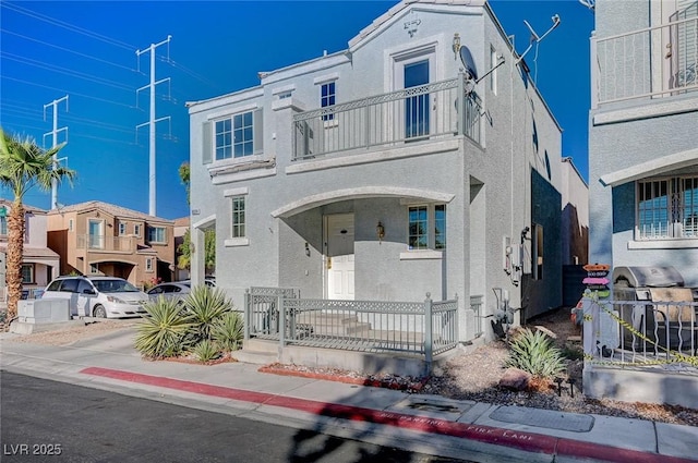 view of front of home featuring a balcony