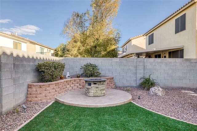 view of yard with a patio area and an outdoor fire pit