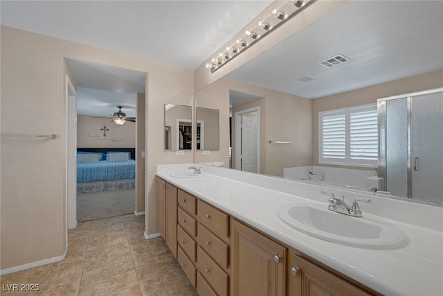 bathroom featuring ceiling fan, independent shower and bath, and vanity