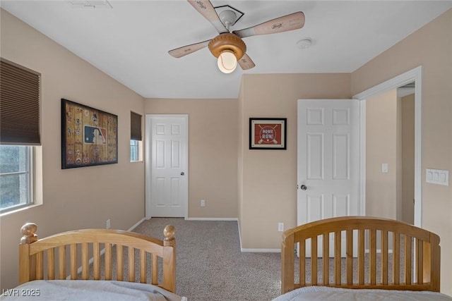 carpeted bedroom with ceiling fan