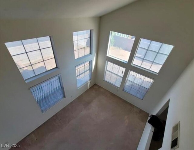 unfurnished living room with carpet floors