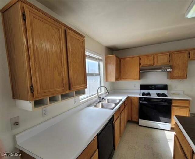 kitchen with dishwasher, sink, and white gas range oven