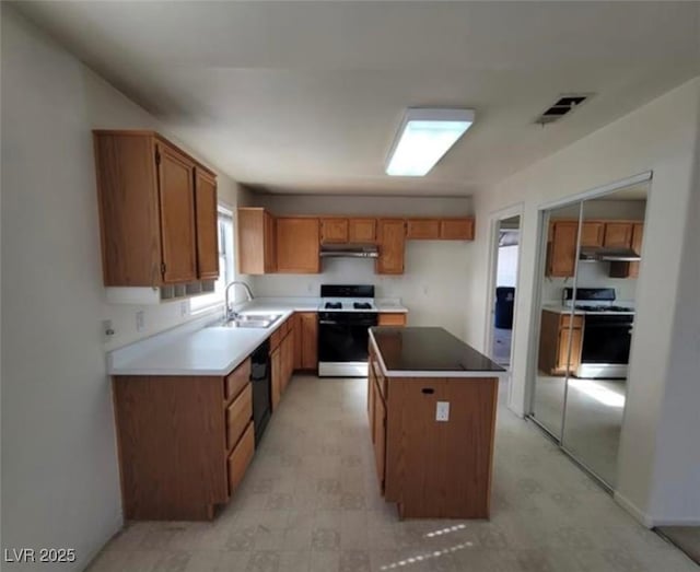 kitchen with white range, sink, electric stove, dishwasher, and a kitchen island