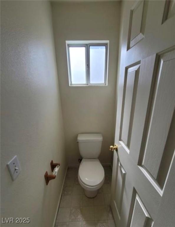 bathroom featuring toilet