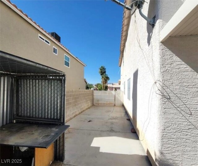 view of side of property featuring a patio