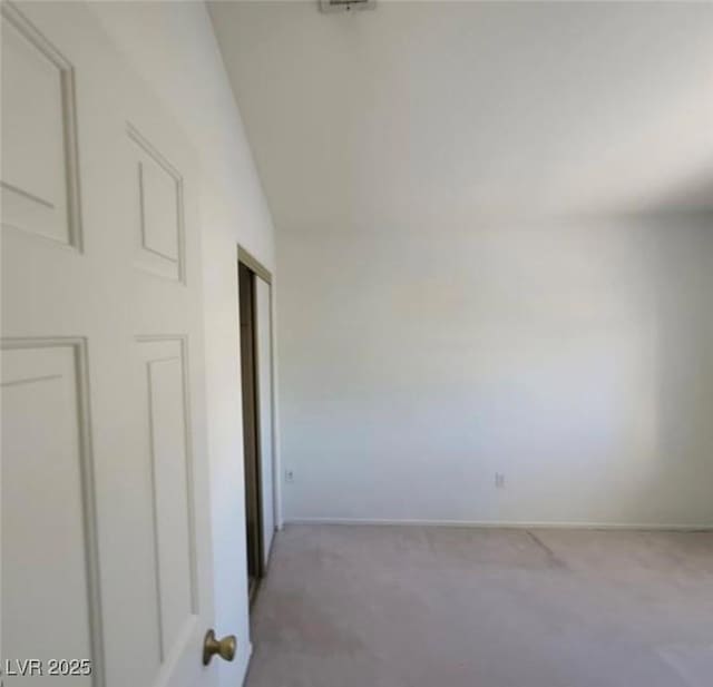 empty room featuring carpet flooring