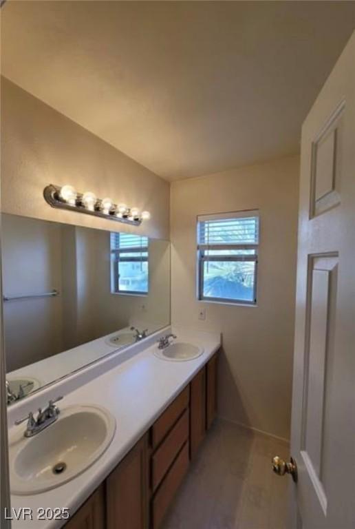 bathroom with vanity and plenty of natural light