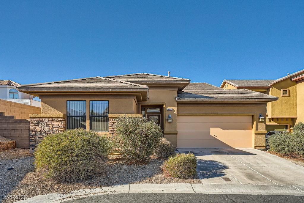 prairie-style home featuring a garage