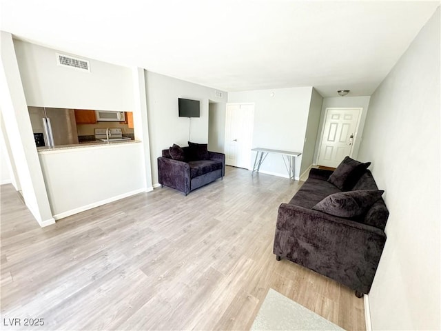 living room featuring light hardwood / wood-style floors