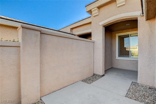 entrance to property with a patio area