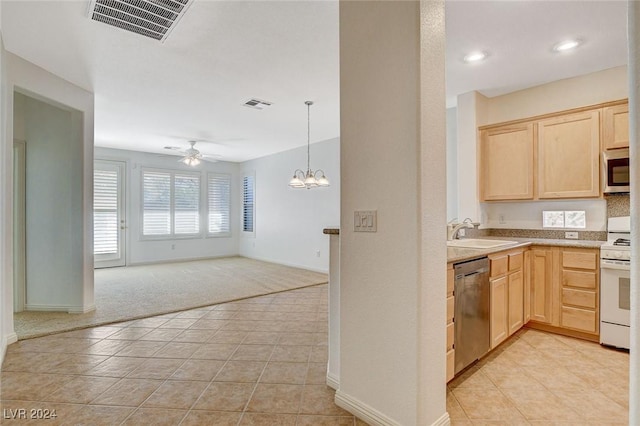 kitchen with ceiling fan with notable chandelier, appliances with stainless steel finishes, light brown cabinets, and sink