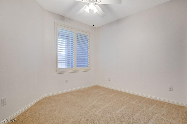 spare room with carpet flooring and ceiling fan