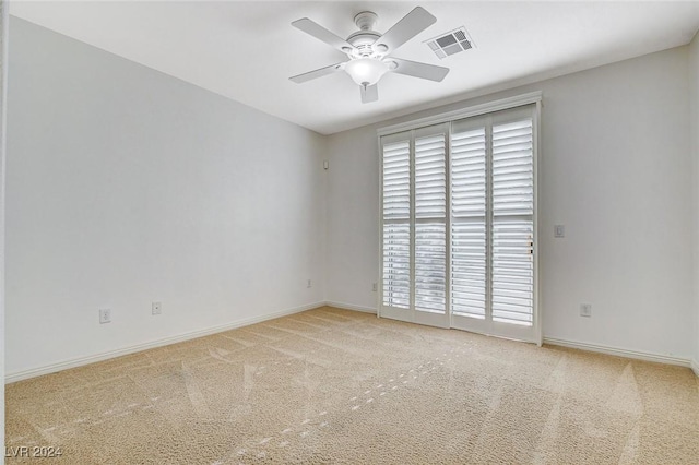 carpeted empty room with ceiling fan