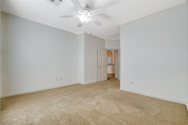 empty room with carpet and ceiling fan