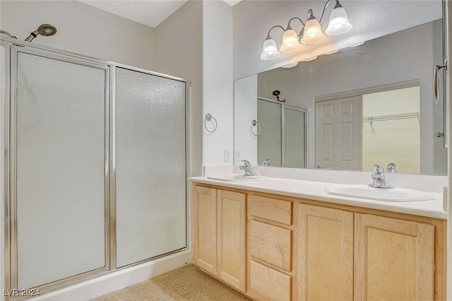 bathroom with vanity and walk in shower