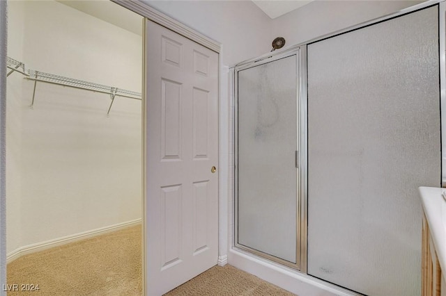 bathroom featuring an enclosed shower