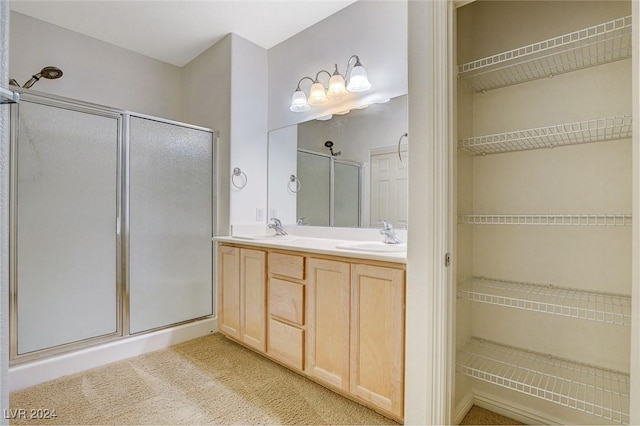 bathroom with vanity and an enclosed shower