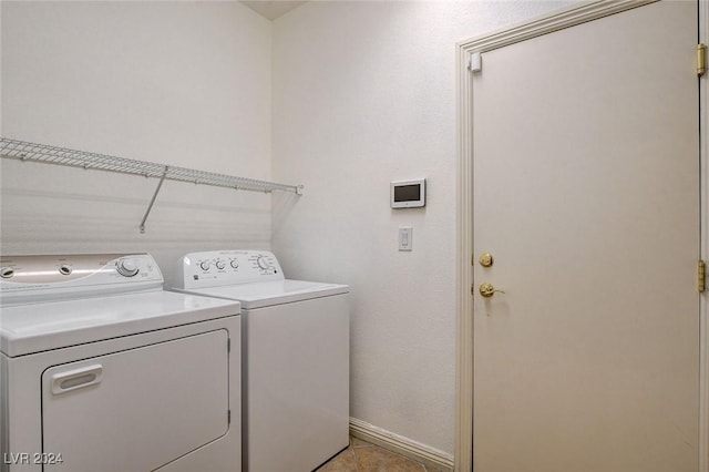 clothes washing area featuring independent washer and dryer and light tile patterned floors